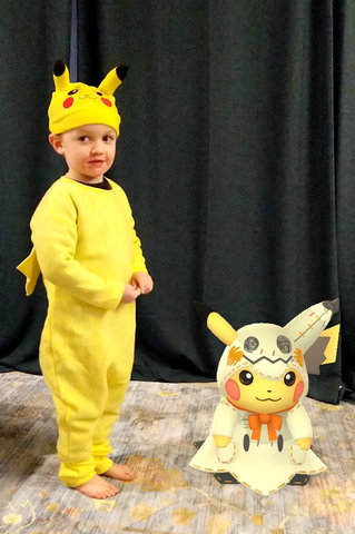 Julian and Pikachu dressed up for Halloween