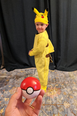 Julian as Pikachu with a Pokeball