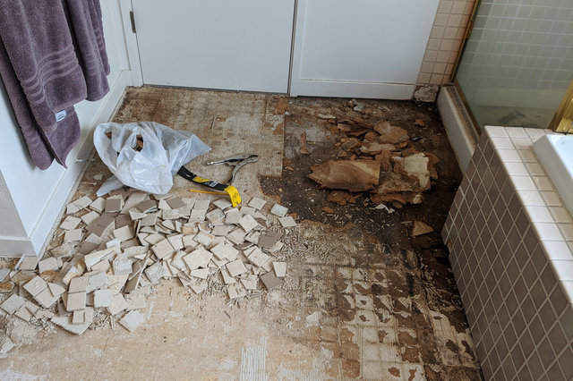 Tile and underlayment removed in master bath