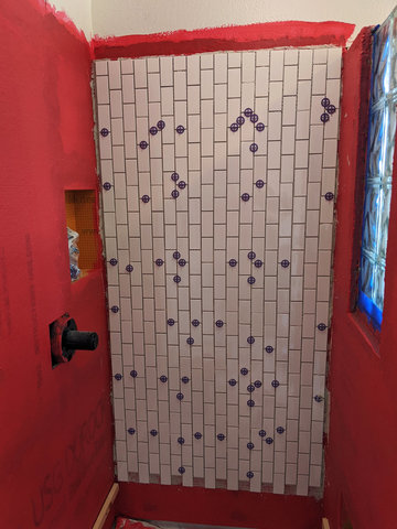 One wall of subway tile in shower