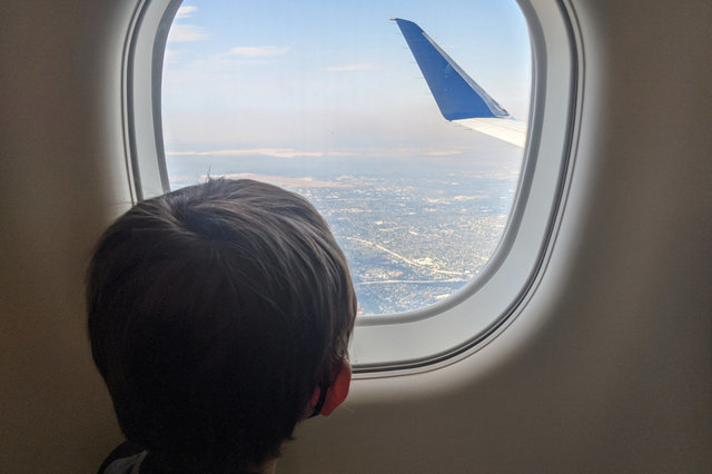 Julian watches the plane descend into San Jose