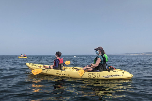 Calvin and Kiesa kayak on Monterey Bay