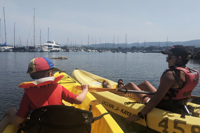 Julian and Sharon on kayaks in Monterey Harbor