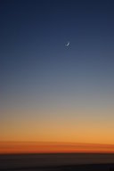 Crescent moon over sunset