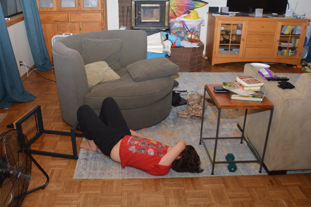 Calvin on the floor after Halloween candy