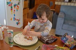 Julian decorates Christmas cookies