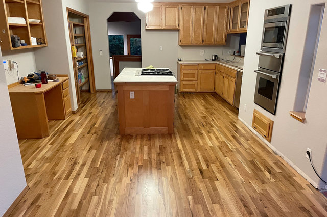 Refinished wood floors in the kitchen at Nanna Ct