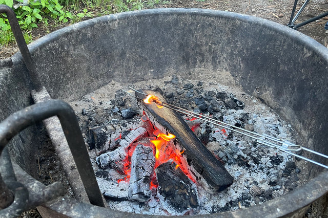 Cheeto on fire over the camp fire