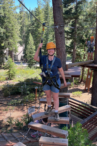 Kiesa crosses an aerial park bridge