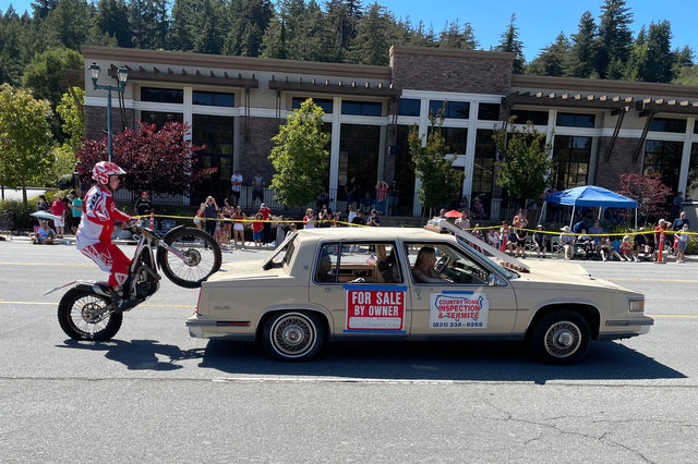 Stunt bike climbs onto sedan