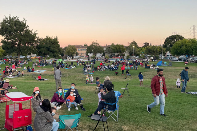 People wait for fireworks in Fuller Street Park