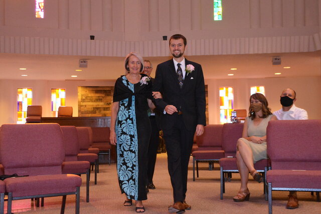 Mom and Dad walk Willy down the aisle