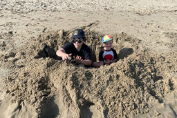 Calvin and Julian in a foxhole on Four Mile Beach
