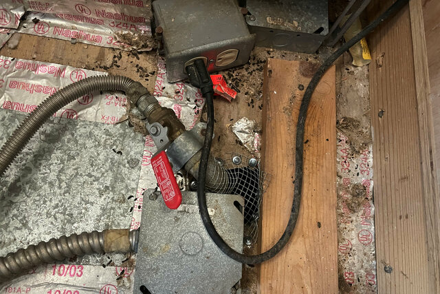 Rat hole in the kitchen covered with wire mesh