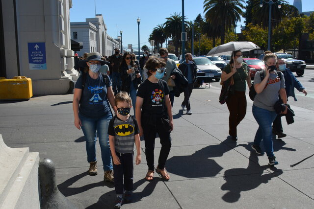 Kiesa, Julian, and Calvin walk down the Embarcadero to Fleet Week