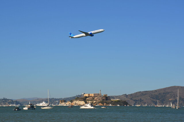 United 777-300 over Alcatraz