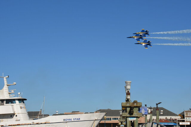 Blue Angels fly in formation above Fisherman's Wharf