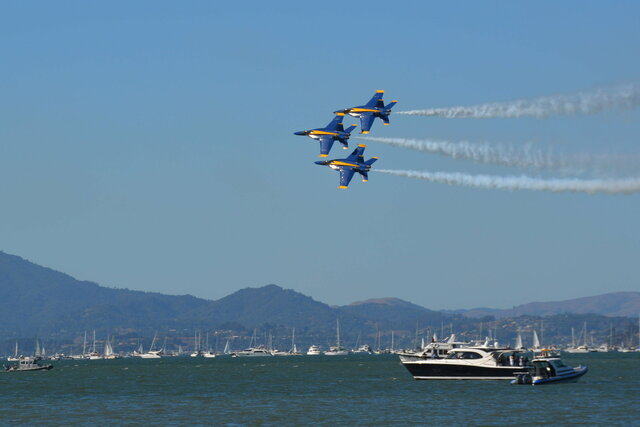 Blue Angels fly in formation above the bay