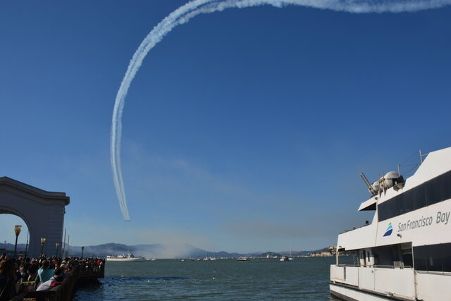 Blue Angels leave a trail of smoke above the bay