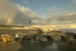 Rainbow over United 777 at SFO