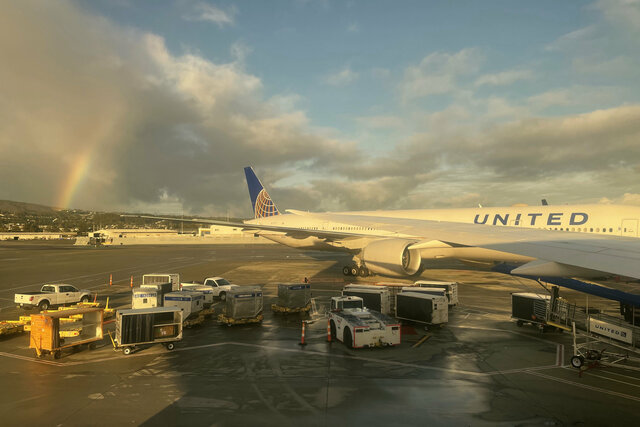 Rainbow over United 777 at SFO