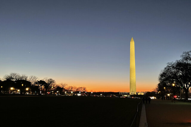 Sun sets behind the Washington Monument