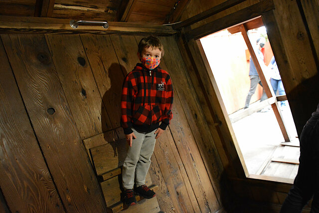 Julian hangs out from the wall at Mystery Spot