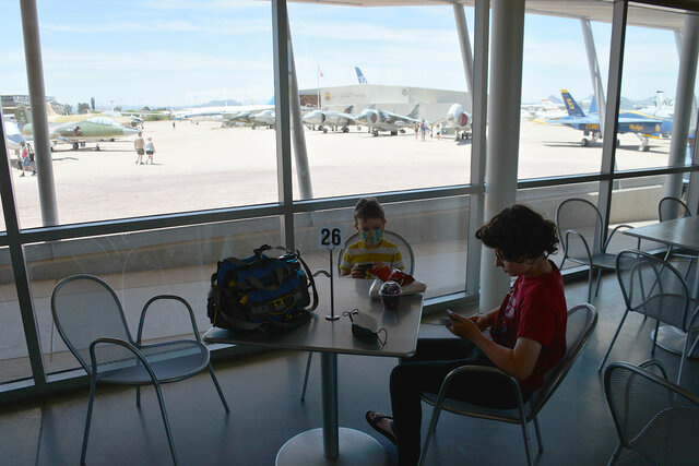 Julian and Calvin wait for lunch at the Pima Air and Space Museum