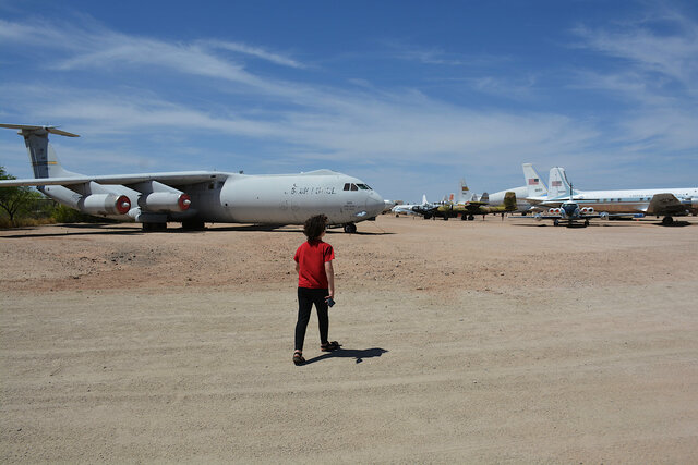 Calvin walks towards a Lockheed C-141B Starlifter