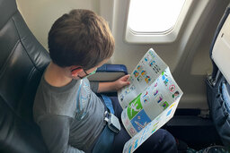 Julian reviews the safety information card of this CRJ-200 aircraft