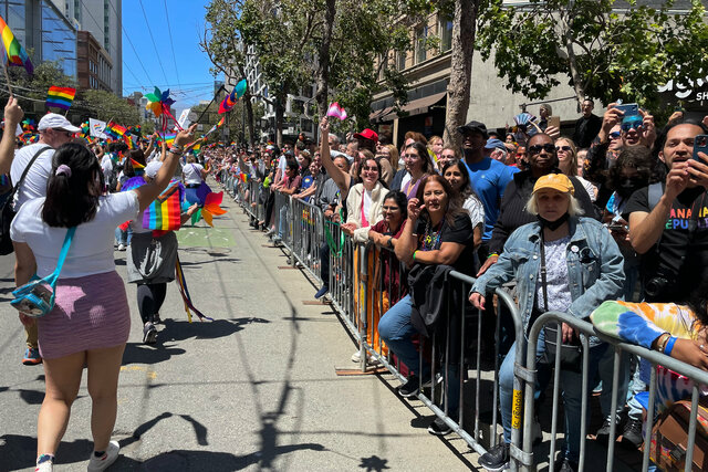 Spectators watch Apple Pride on Market Street