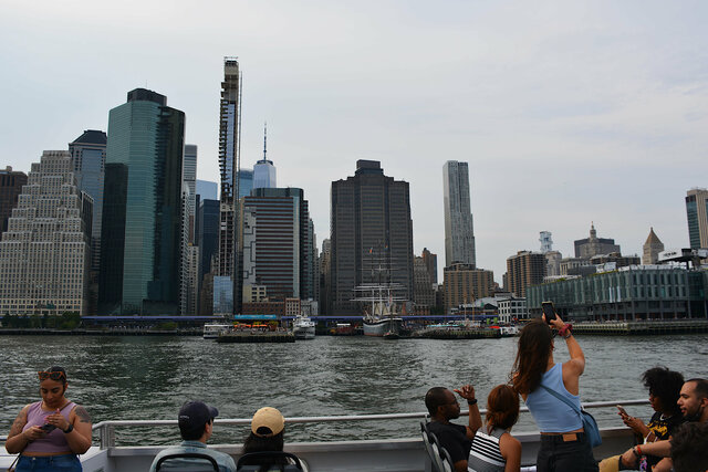 Ferry cruises past Pier 16