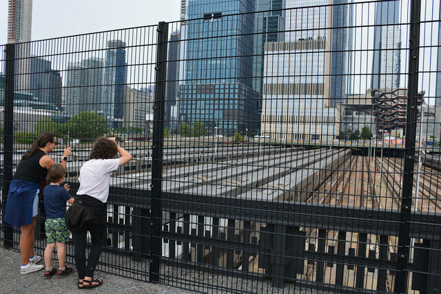 Bethany, Julian, and Calvin look out over Hudson Yards