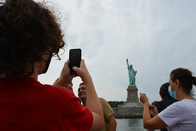 Calvin photographs the Statue of Liberty
