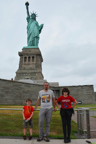 Julian, Jaeger, and Calvin with the Statue of Liberty