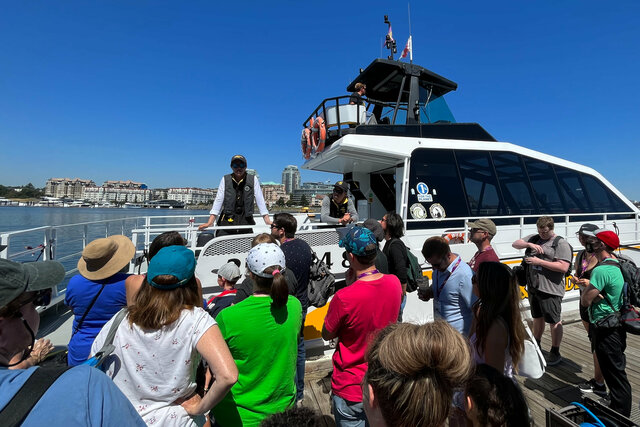 Whale watching guide briefs passengers