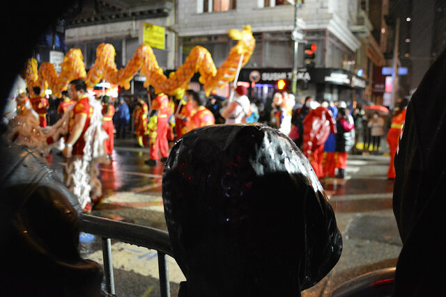 Julian watches a lion dance