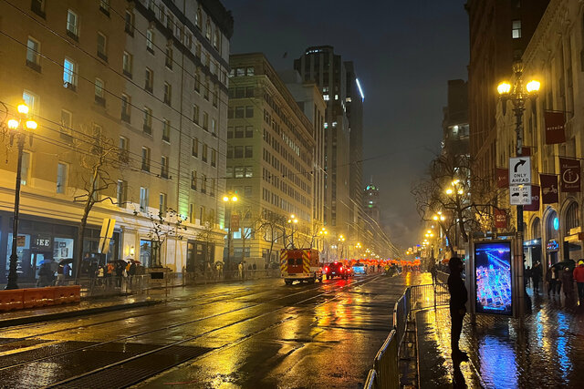 The very end of the Chinese New Year parade on a rainy Market Street