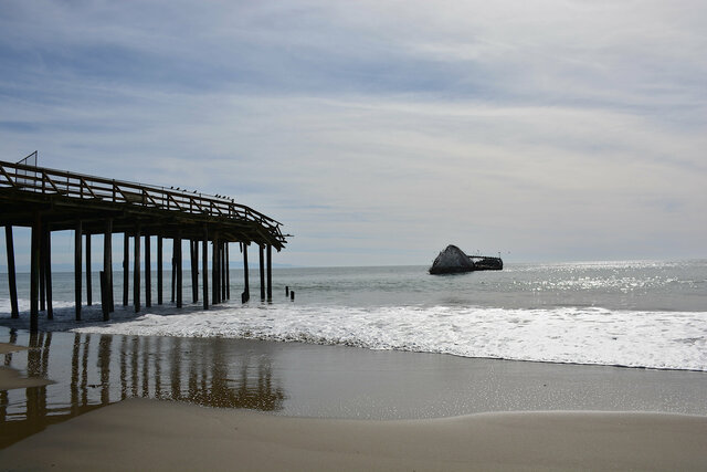 The concrete ship past the end of the pier