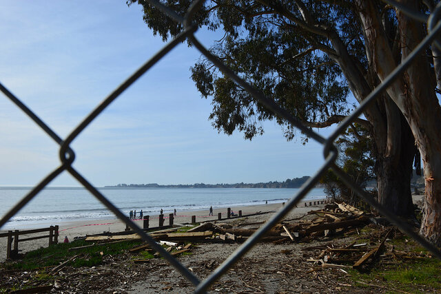 Seacliff Beach through a chain-link fence