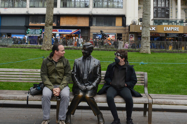 Jaeger and Calvin with a statue of Mr. Bean in Leicester Square