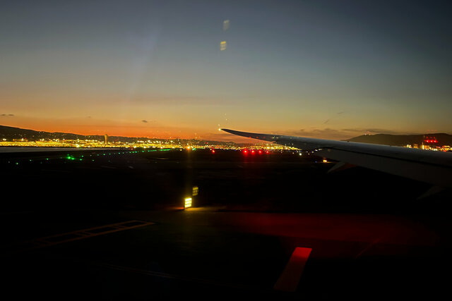 At the end of the runway ready to take off from SFO at dusk