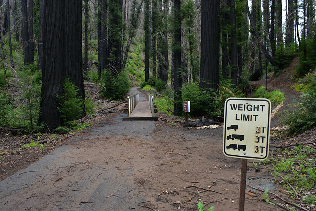 Old weight limit sign with a temporary bridge over Opal Creek