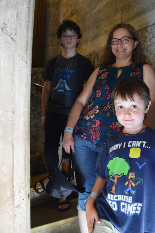 Calvin, Kiesa, and Julian in a spiral staircase at Hearst Castle