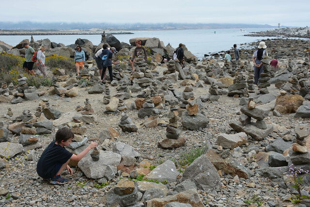 Julian builds a rock stack at Morro Rock