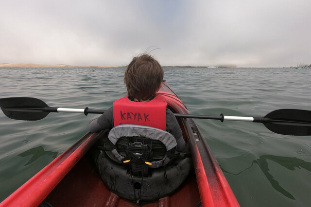 Julian kayaks on Morro Bay