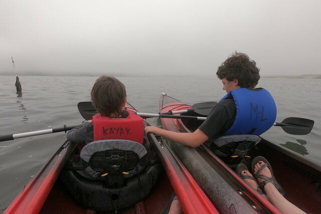 Julian and Calvin on kayaks in Morro Bay