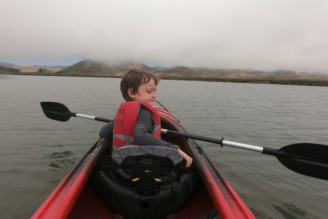 Julian kayaks up Morro Bay Estuary