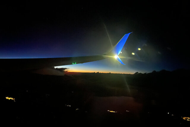 737 wing and dusk over the Rockies