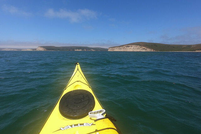 Kayak crossing the mouth of Drakes Estero